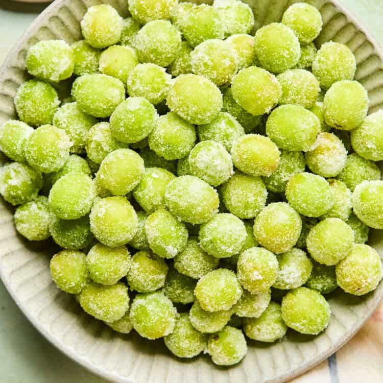 Frozen Sweet & Sour Candy Grapes in a bowl.