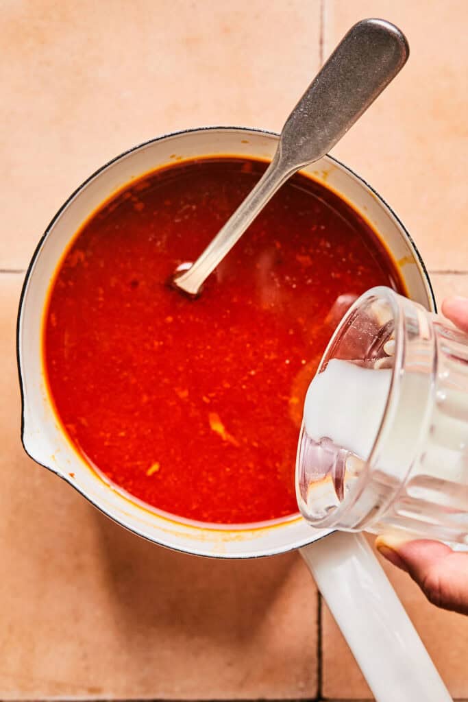 Liquid from Honey Chipotle Chicken in a saucepan.
