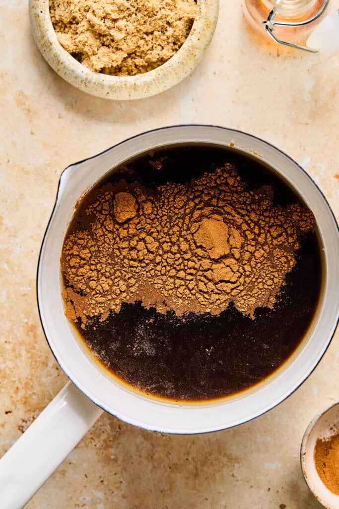 Cinnamon and vanilla added to the mixture in the sauce pan.