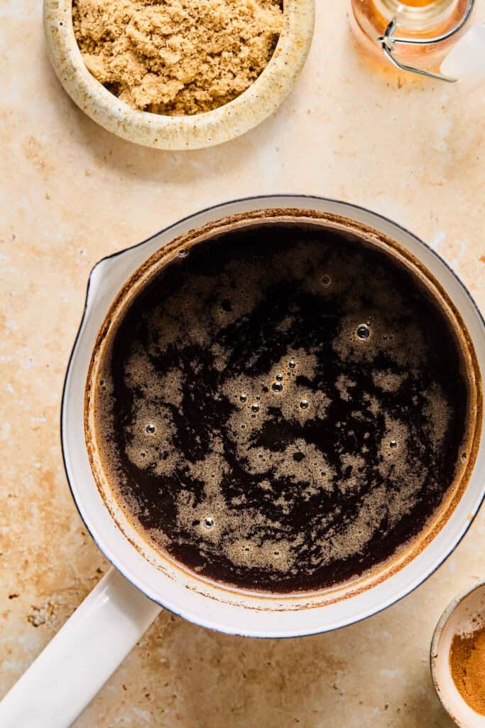 Brown sugar and water in a sauce pan.