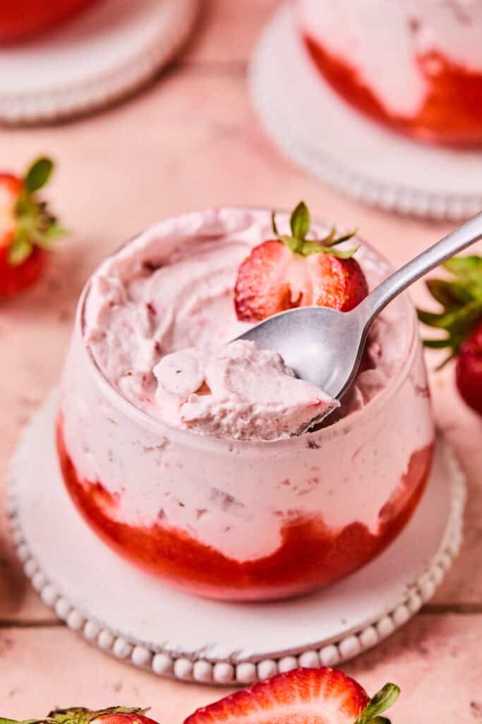 Strawberry Mousse Parfait in a small bowl with a spoon.