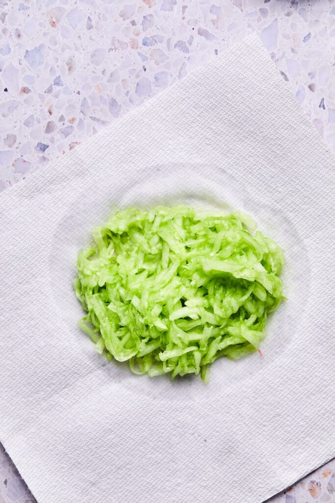 Grated cucumber on a paper towel.