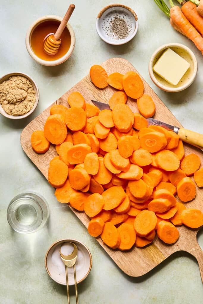 Sliced carrots on a cutting board.