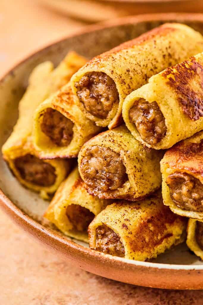Sausage French Toast Roll ups on a platter.