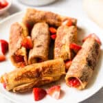 Strawberries and Cream French Toast Roll Ups on a plate.
