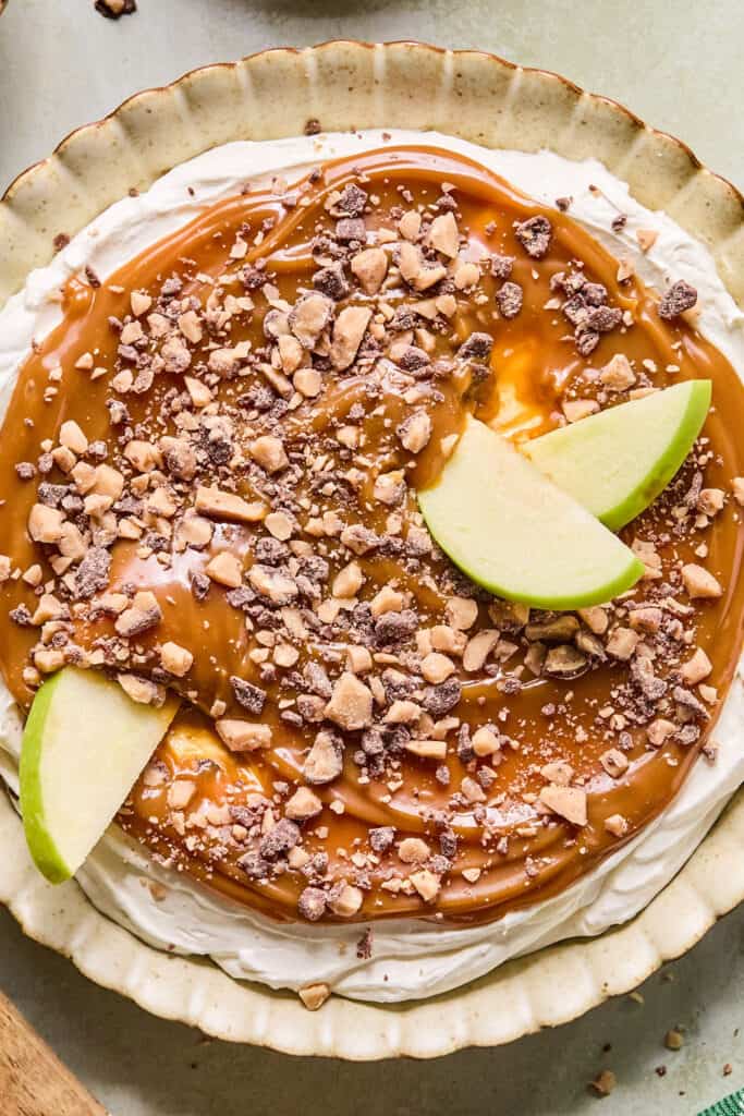 Cream Cheese Caramel Apple Toffee Dip with apple slices.