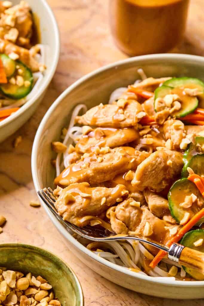 Thai Peanut Chicken Noodle Bowls with forks.