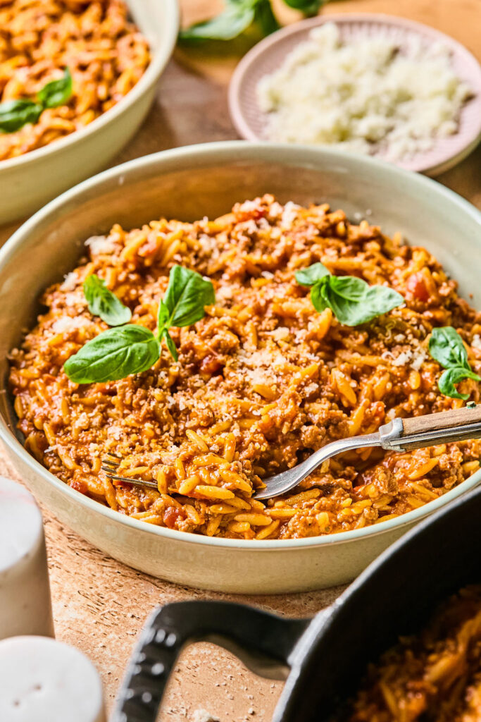 One-Skillet Ground Beef Orzo in a bowl with a fork.