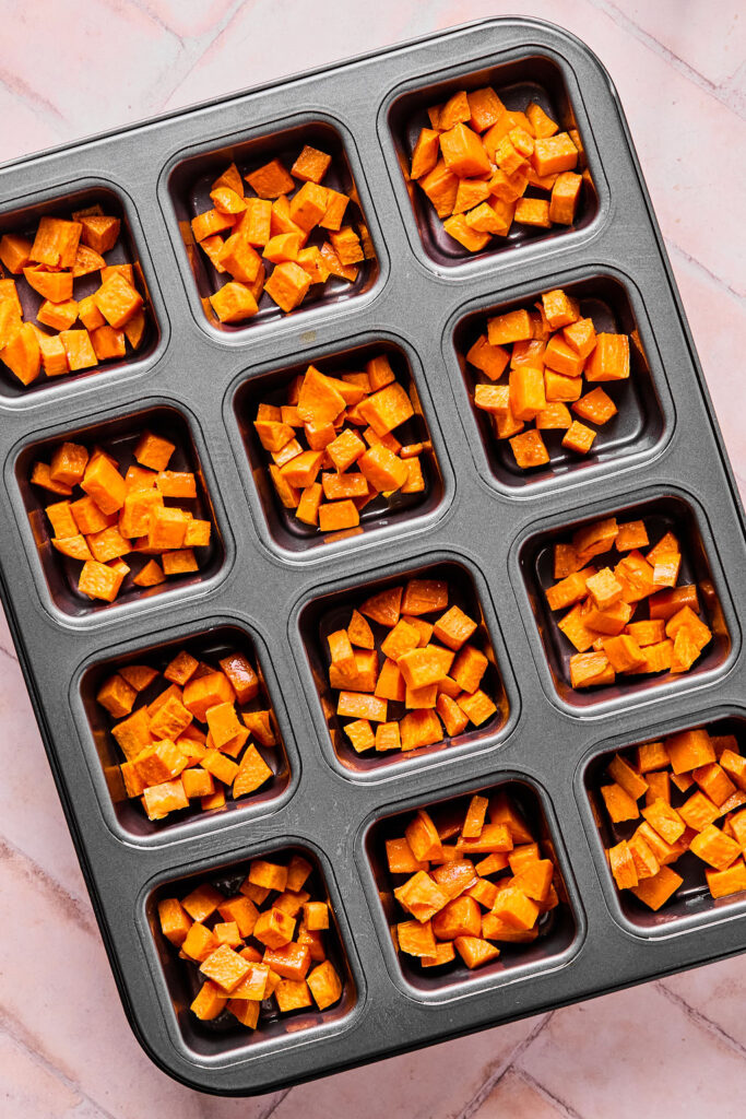 Subed sweet potatoes in a brownie pan.