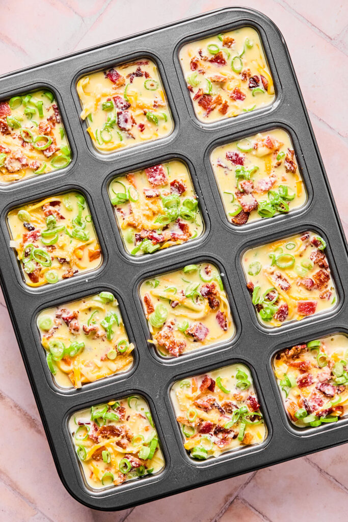 Egg mixture poured over the ingredients in the brownie pan.