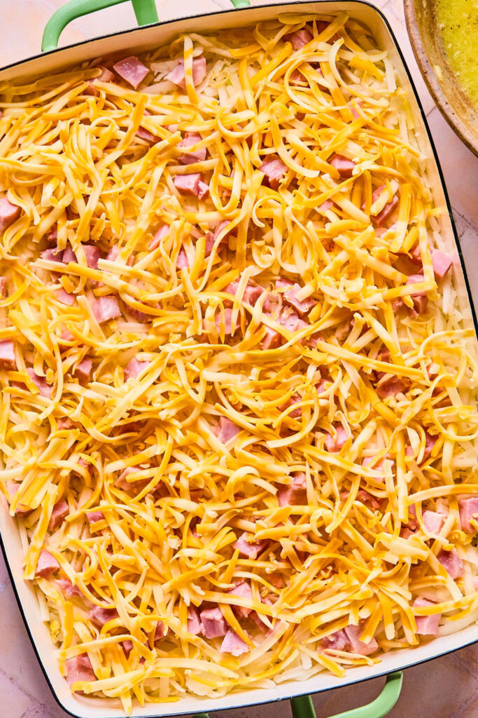 Ham and Cheese Hashbrown Casserole in a baking dish before being baked.