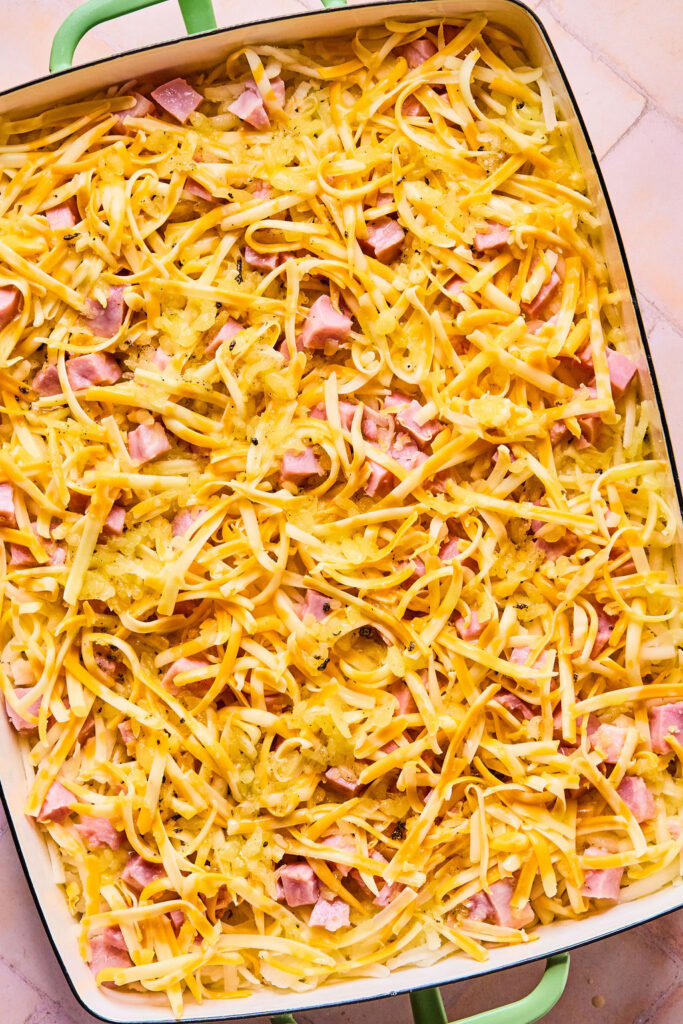 Ham and Cheese Hashbrown Casserole in a baking dish before being baked.