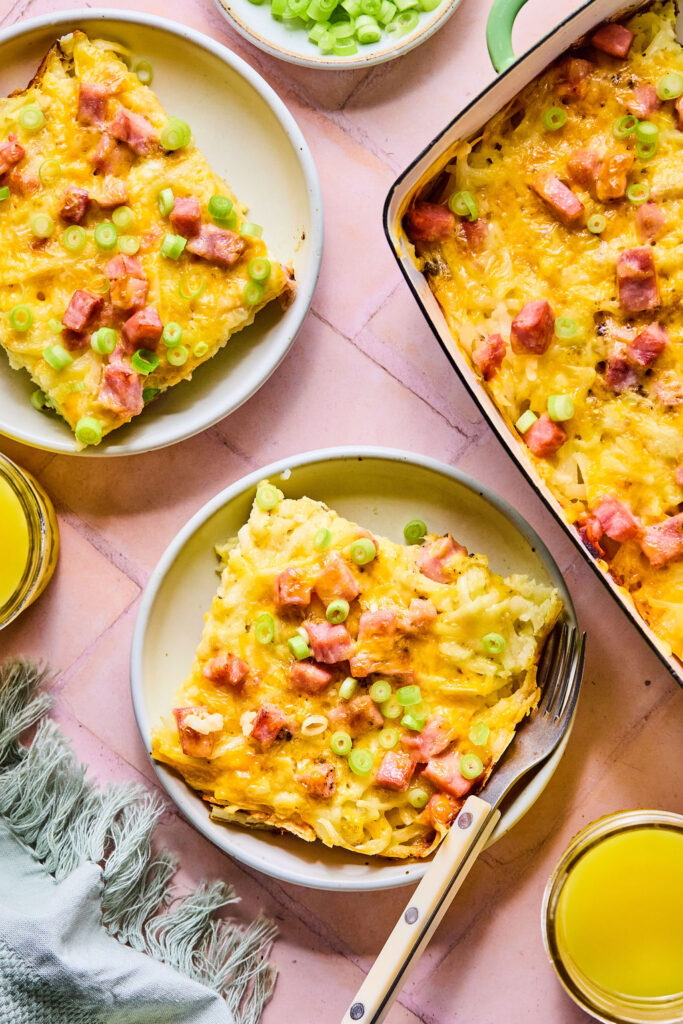Ham and Cheese Hashbrown Casserole in a baking dish and on small plates.
