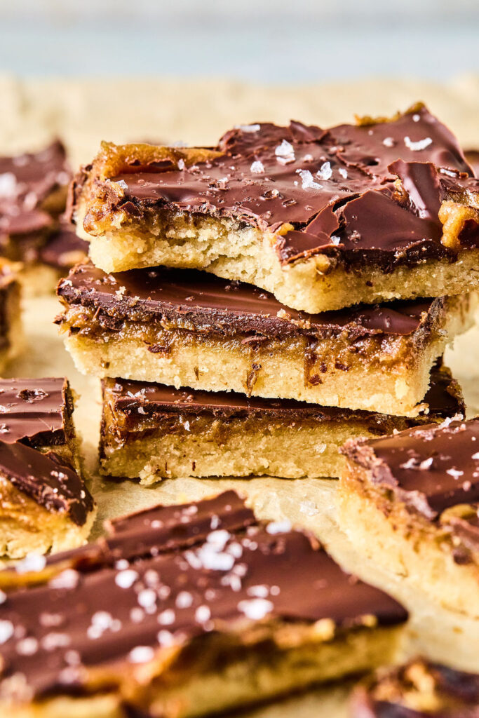 Salted Caramel Date Bars stacked in a pile.