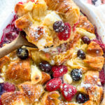 Berry Cheesecake Croissant Bake in a baking dish.
