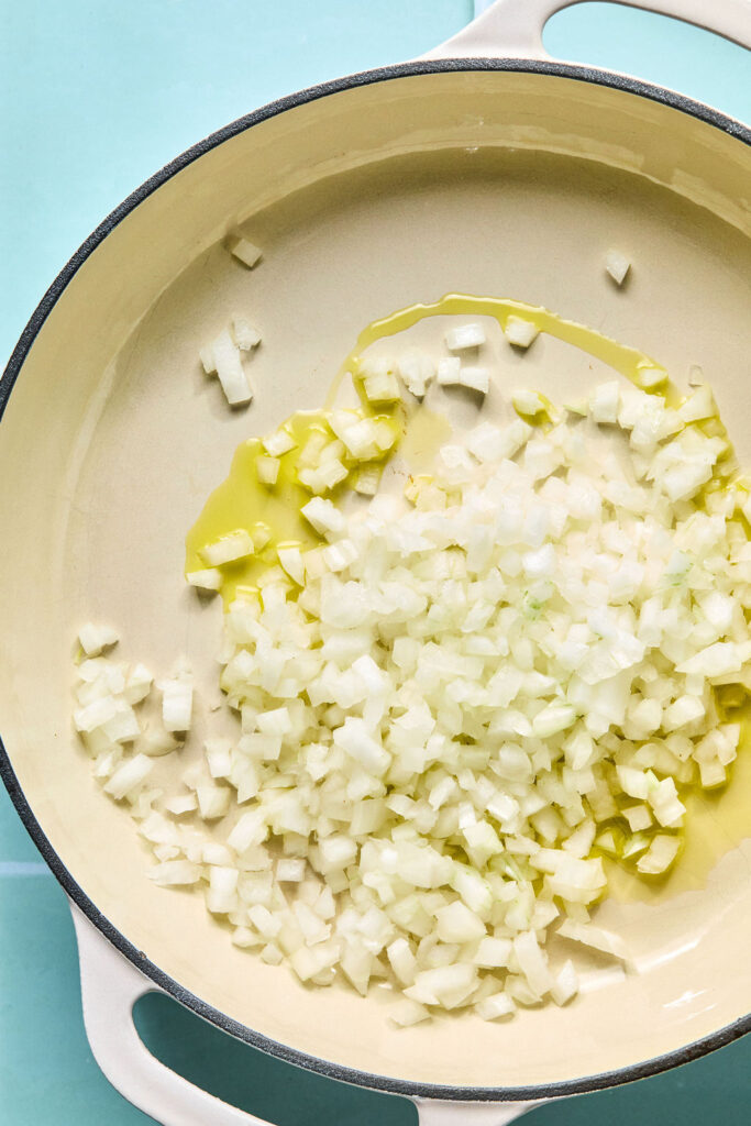 Diced onion and olive oil in a skillet.
