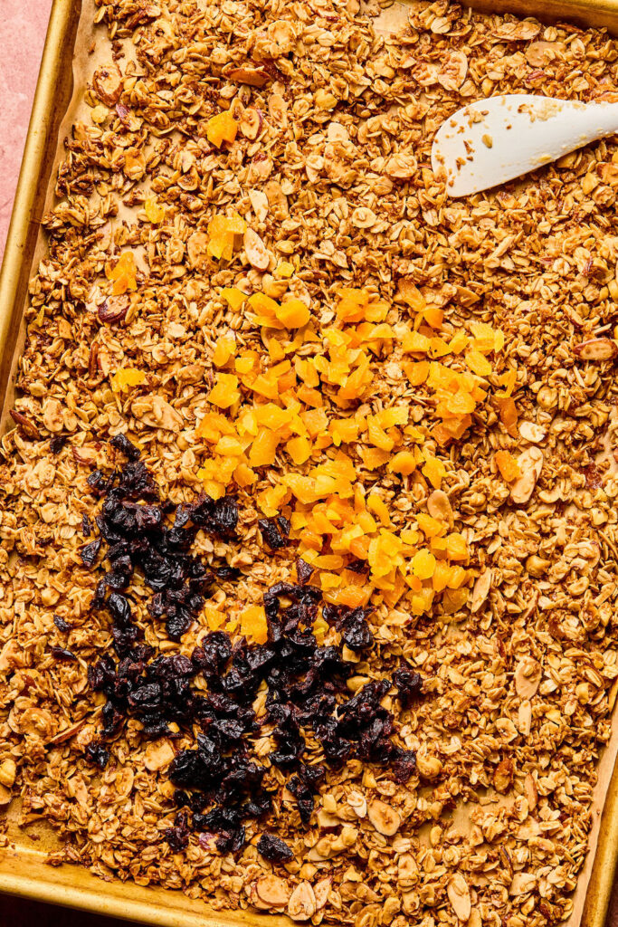 Dried cherries and apricots on the Hazelnut Maple Granola on the sheet pan.