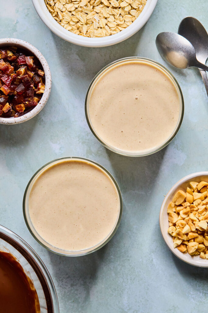 Snickers Blended Overnight Oats in divided into two jars.