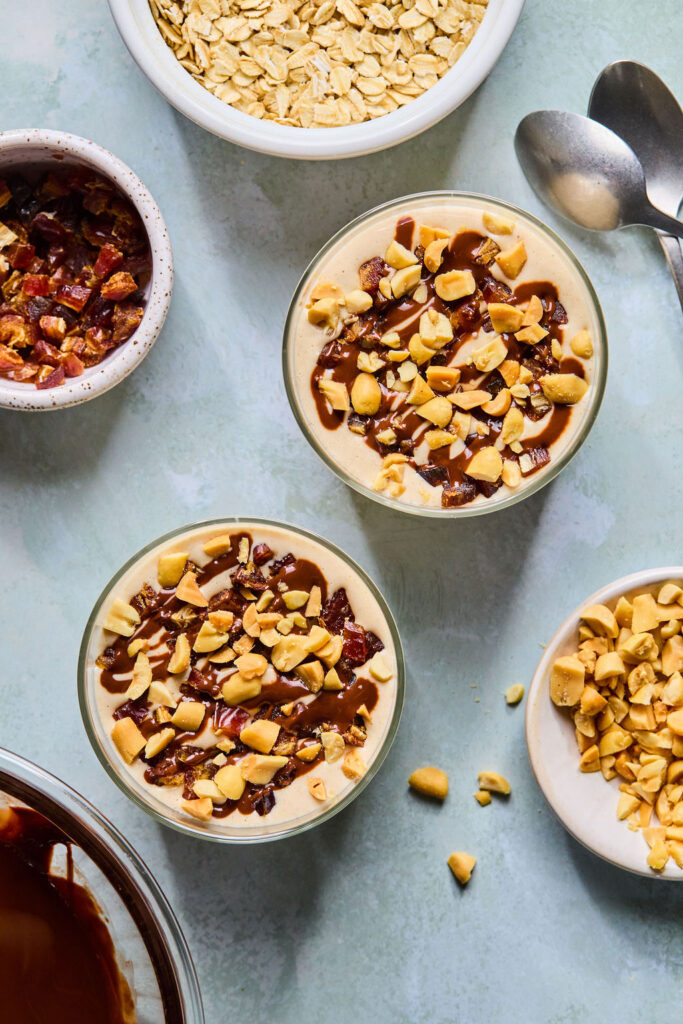 Snickers Blended Overnight Oats in jars.