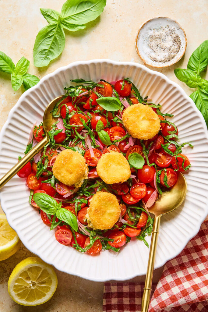 Crispy Goat Cheese & Tomato Salad in a bowl with a fork.