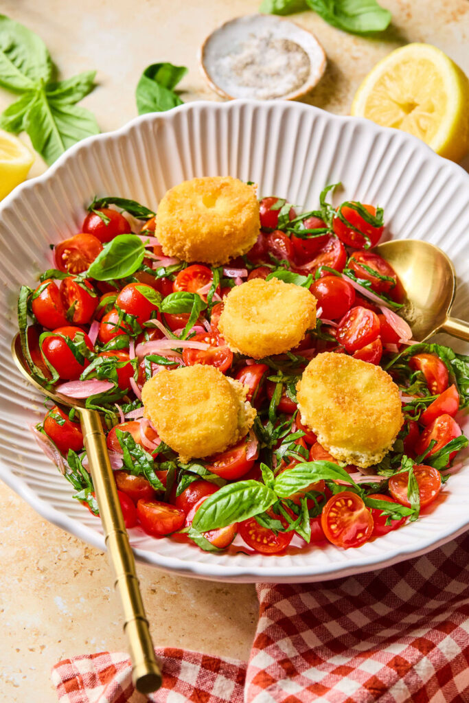 Crispy Goat Cheese & Tomato Salad in a bowl with a fork.
