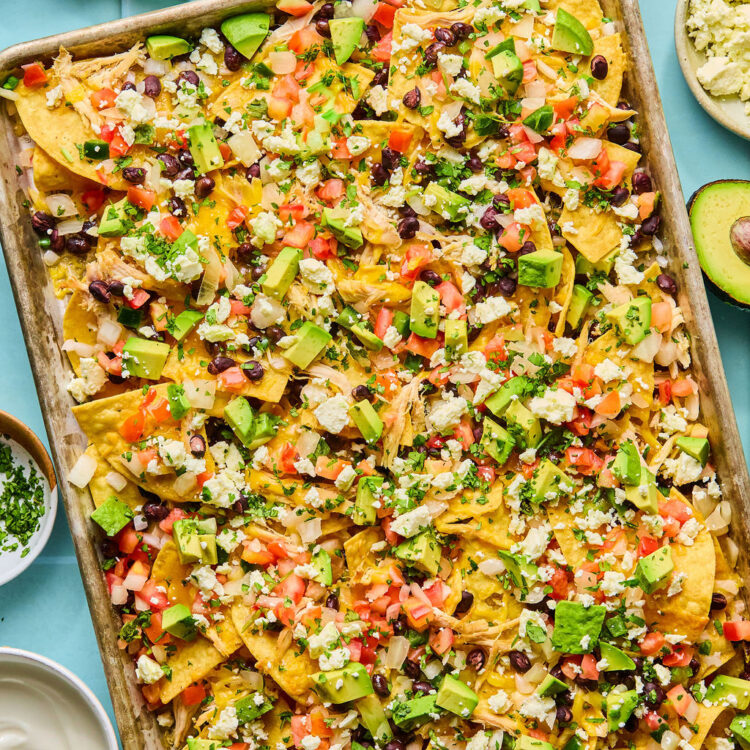 Chicken sheet pan nachos on a baking sheet.