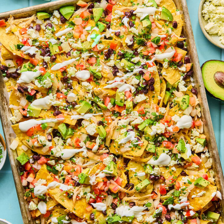 Chicken sheet pan nachos on a baking sheet.