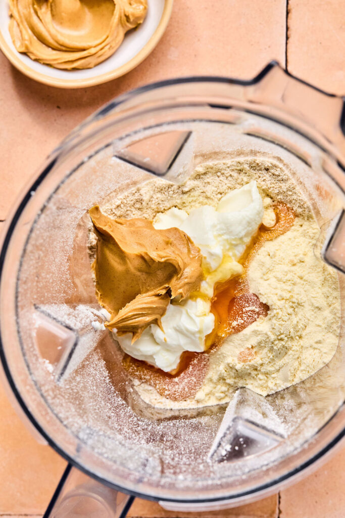 The rest of the ingredients for Peanut Butter Smoothie in a blender.