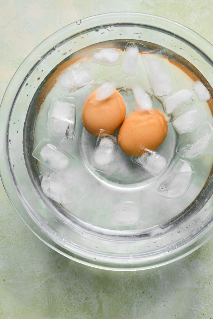 Eggs in an bowl of ice water.