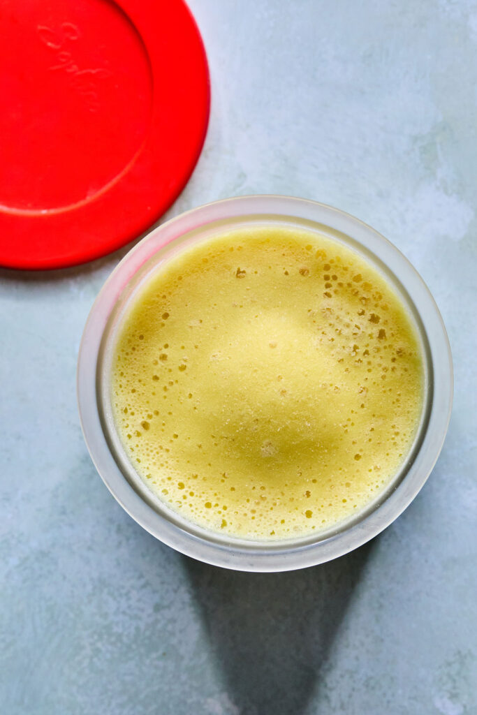 Ninja Creami Pineapple Sorbet in a Ninja creami pint.
