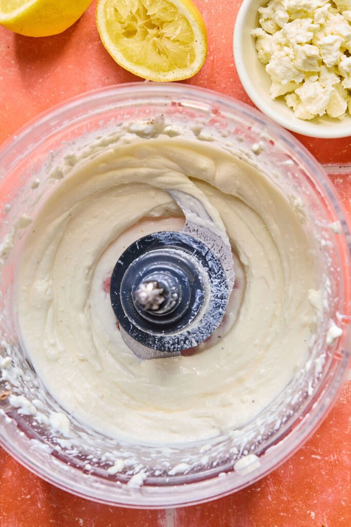 Whipped feta sauce in a food processor bowl.