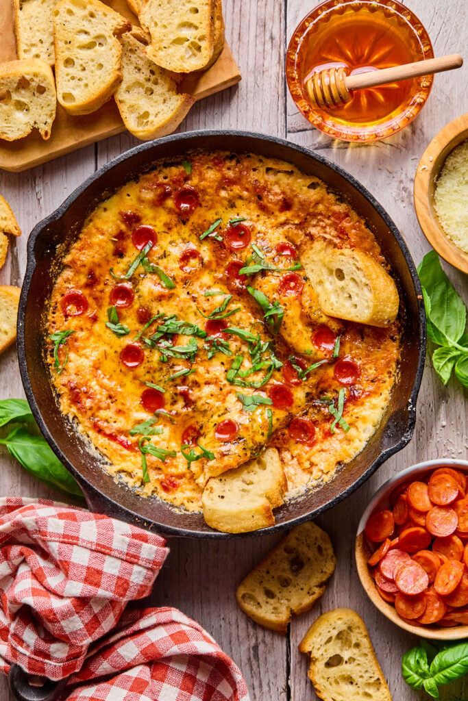 Hot Honey Pizza Dip in a round dish.