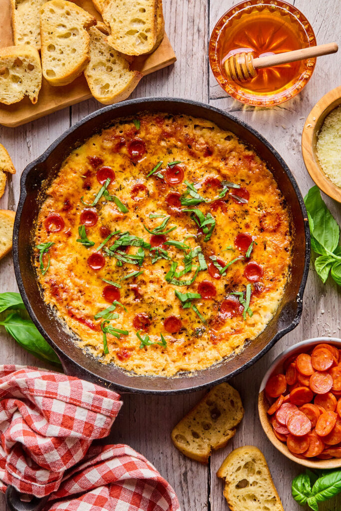 Hot Honey Pizza Dip in a round dish.