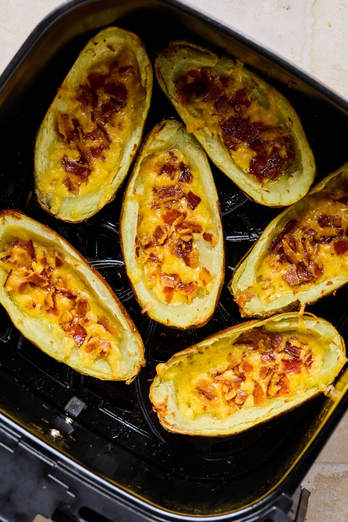 Air Fryer Potato Skins in an air fryer basket.