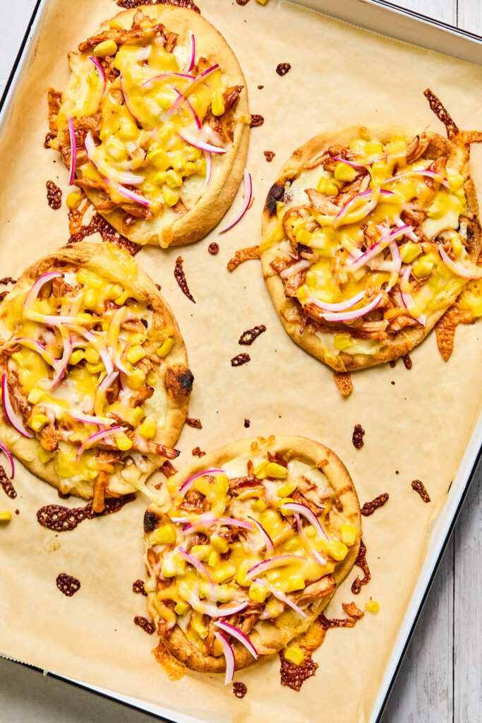 Sheet Pan BBQ Chicken Flatbread on a sheet plan after being baked.