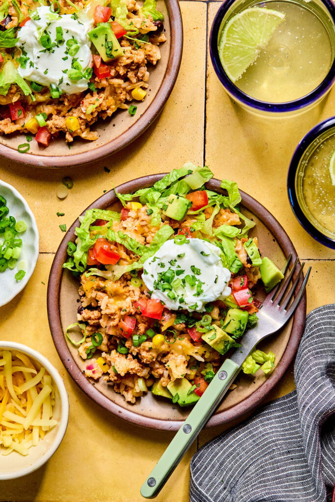 Cheesy Turkey Taco Rice Bake on a plate with a fork.