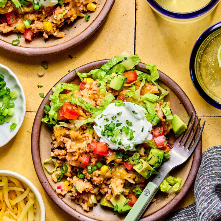 Cheesy Turkey Taco Rice Bake on a plate with a fork.