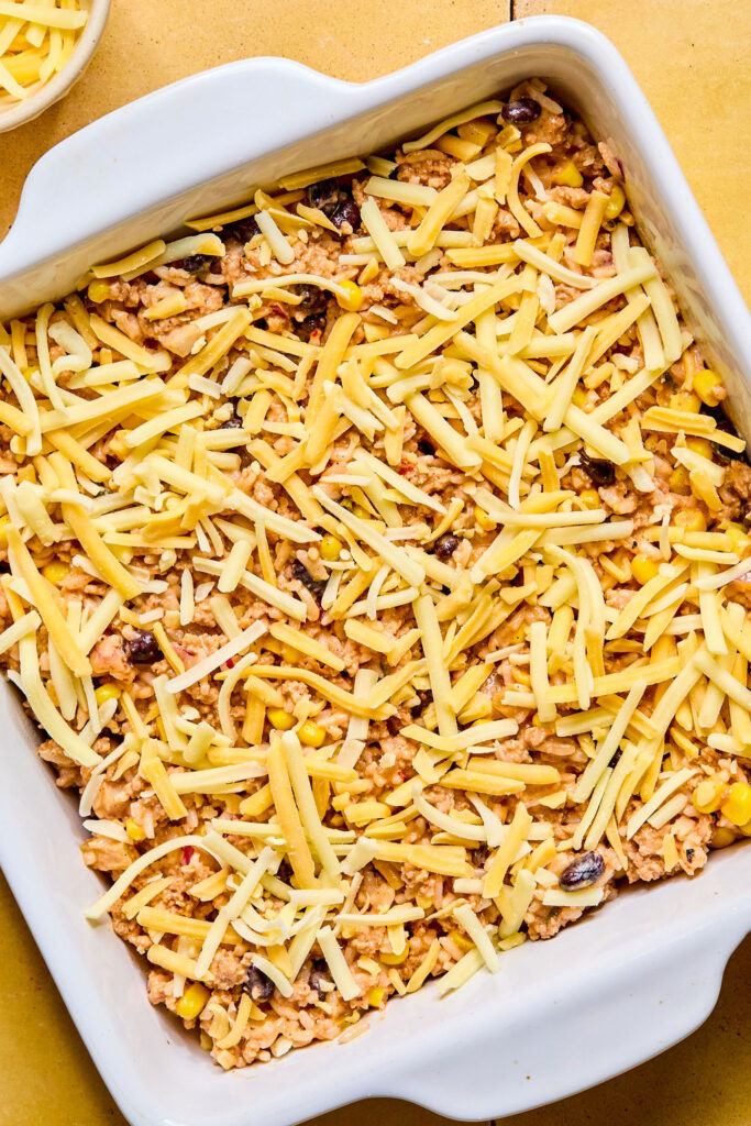Cheesy Turkey Taco Rice Bake in a baking dish before being combined.