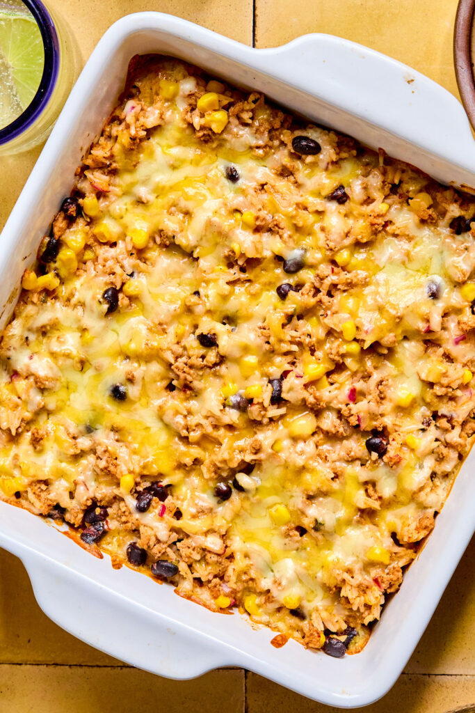 Cheesy Turkey Taco Rice Bake in a baking dish after being baked.