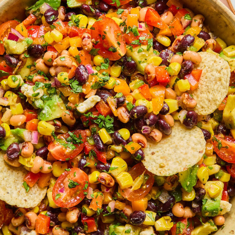 Rainbow Cowboy Caviar in a bowl with tortilla chips.