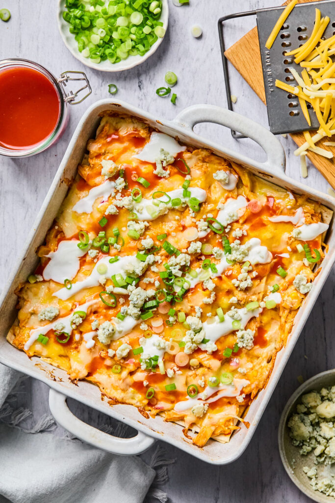 Buffalo Chicken Enchilada Bake in a square baking dish.