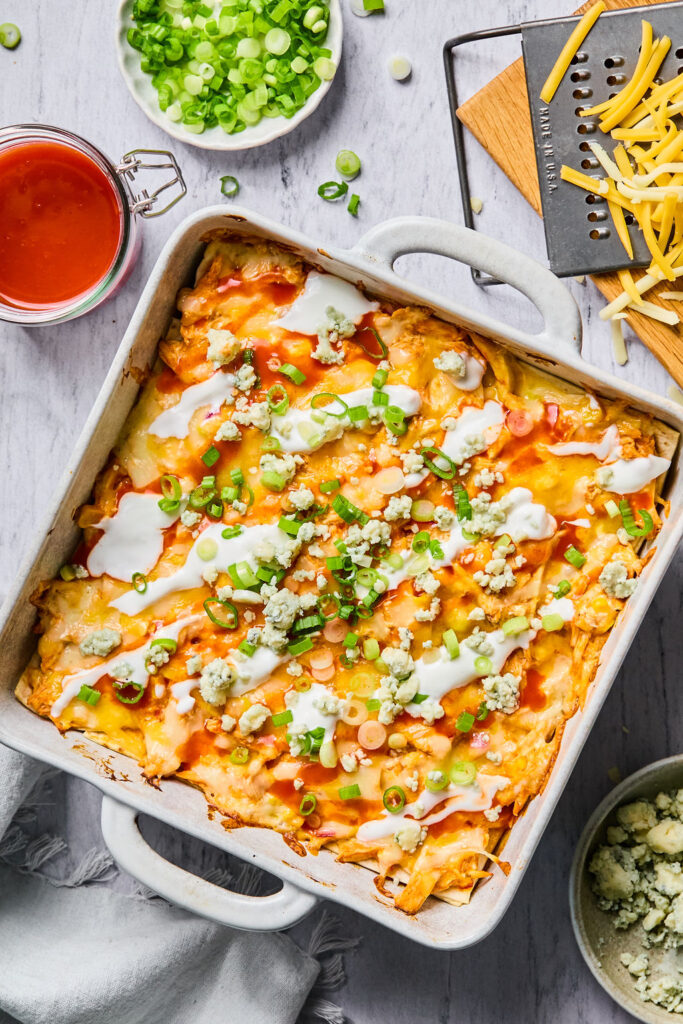 Buffalo Chicken Enchilada Bake in a square baking dish.