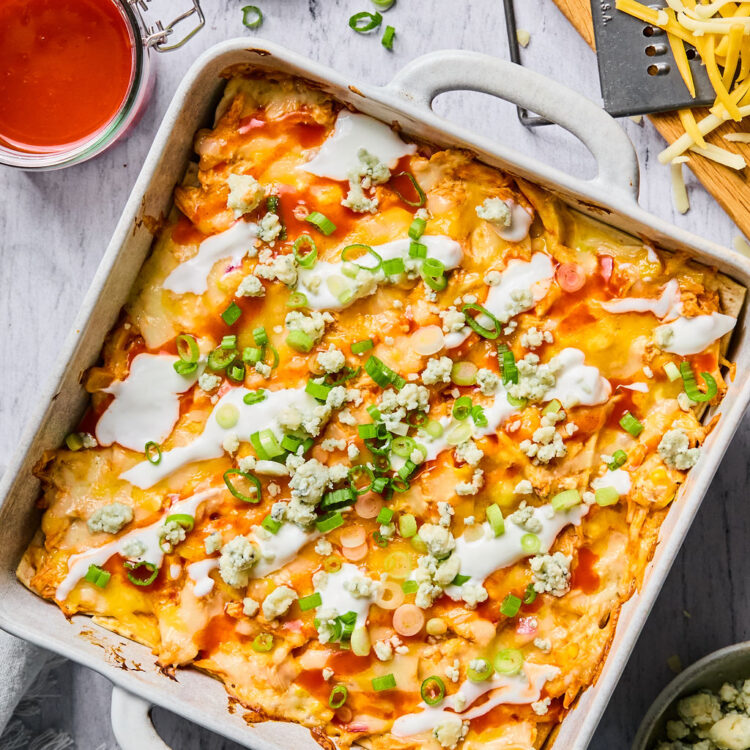 Buffalo Chicken Enchilada Bake in a square baking dish.