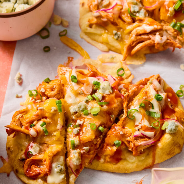 Buffalo Chicken Flatbreads on parchment paper.