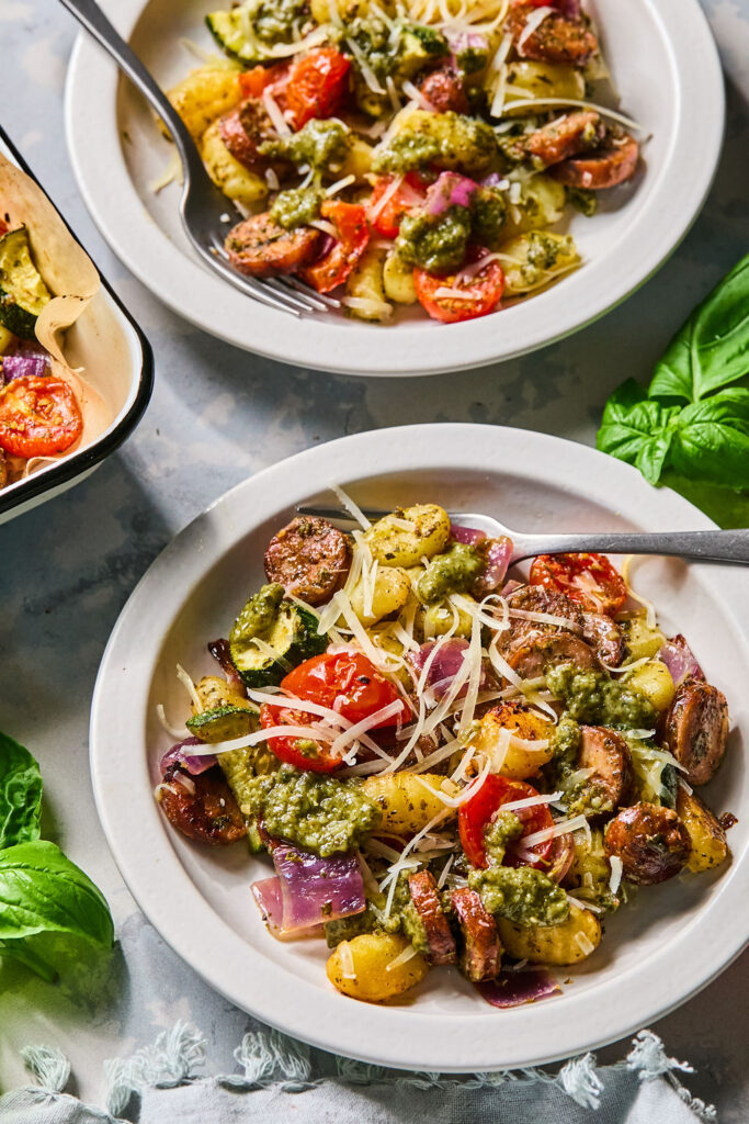 Sheet Pan Chicken Sausage & Veggie Gnocchi on a plate with a fork.