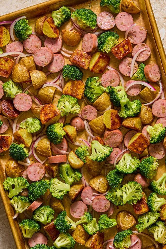 Honey Mustard Chicken Sausage and Potato Sheet Pan on a baking sheet before being baked.