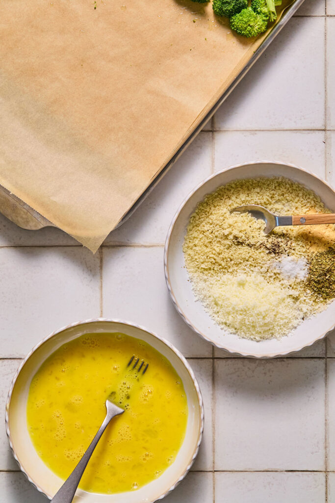 Bowls of beaten and a breadcrumbs.