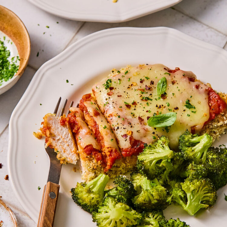 Sheet Pan Chicken Parmesan and Broccoli served on a plate.