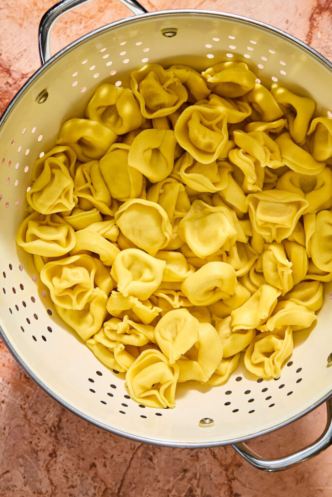 Tortillini in a strainer