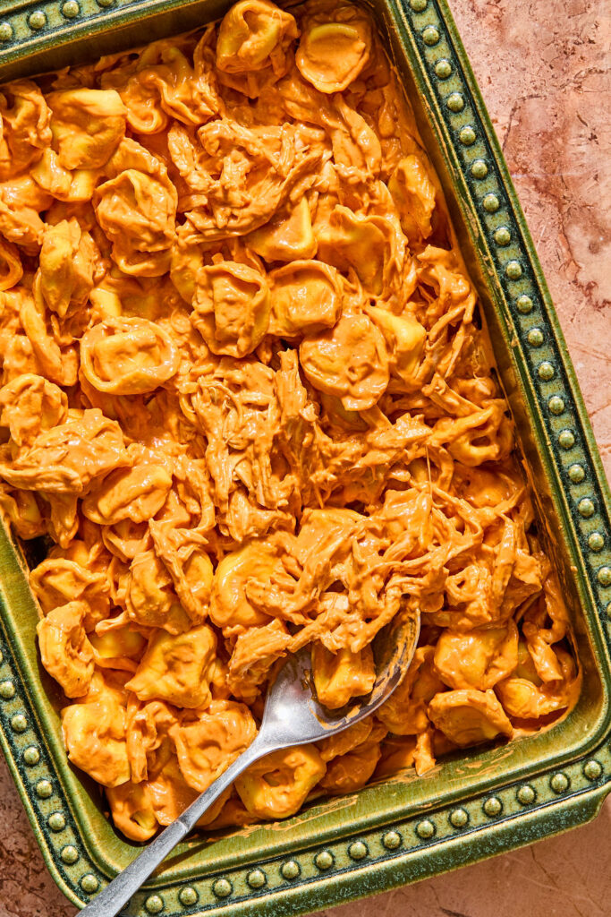Chicken Parmesan Tortellini Bake in a baking dish before being baked.